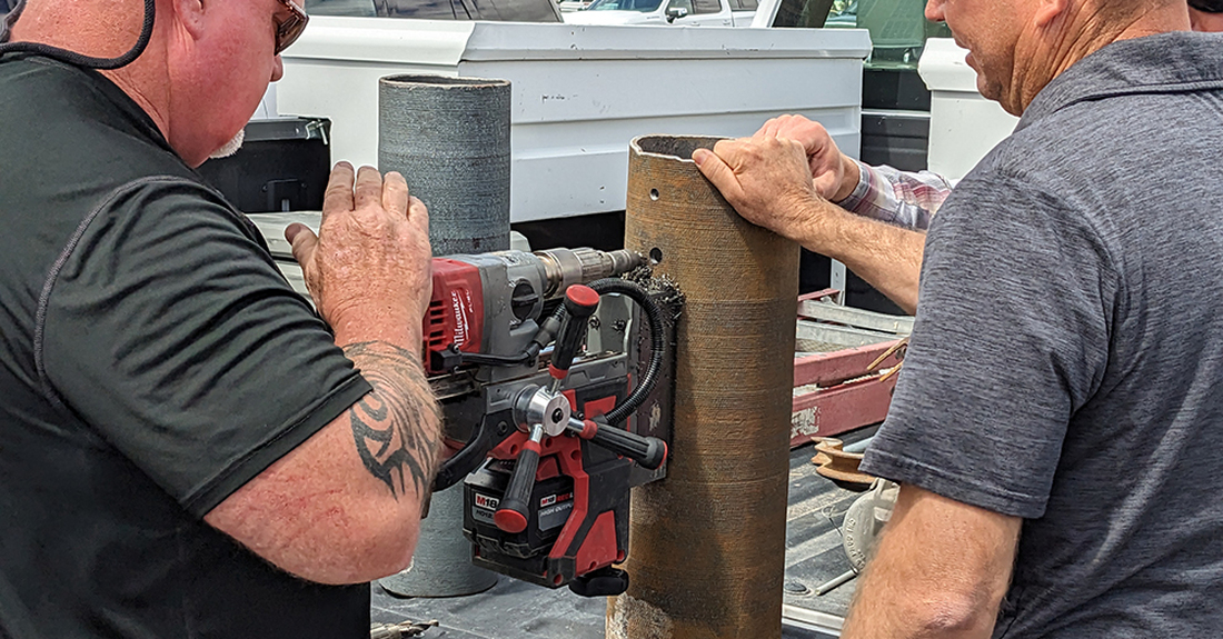Mean working on an iron pole